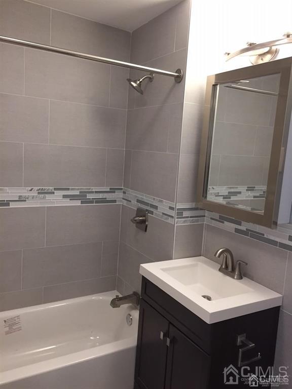 9 Christopher Street, Unit 2 Carteret, NJ 07008 - Photo 6 of 15 a bathroom with a sink and a mirror