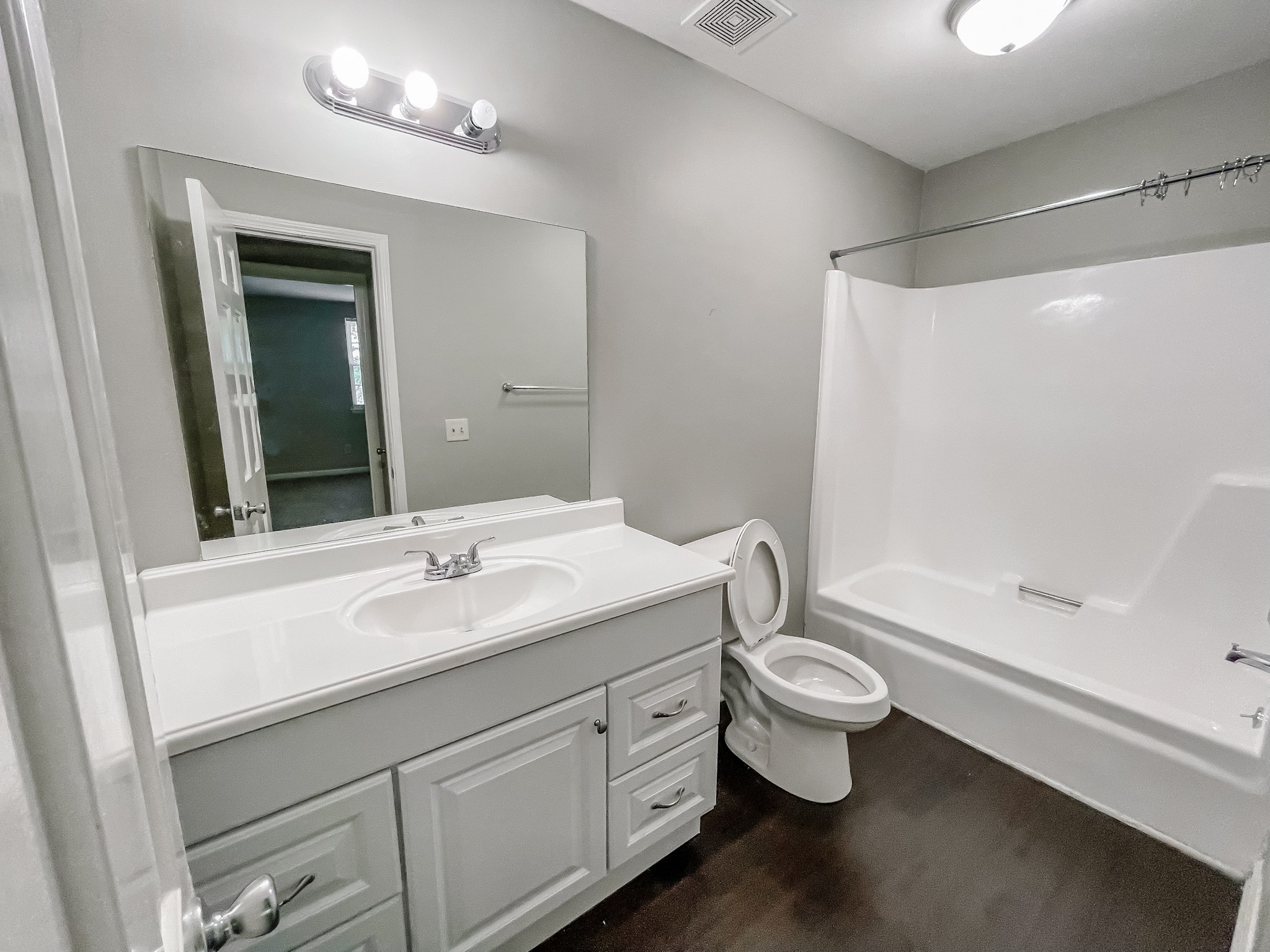 1301 Neelys Bend Road, Unit 45 Madison, TN 37115 - Photo 17 of 19 a bathroom with a double vanity sink toilet and shower