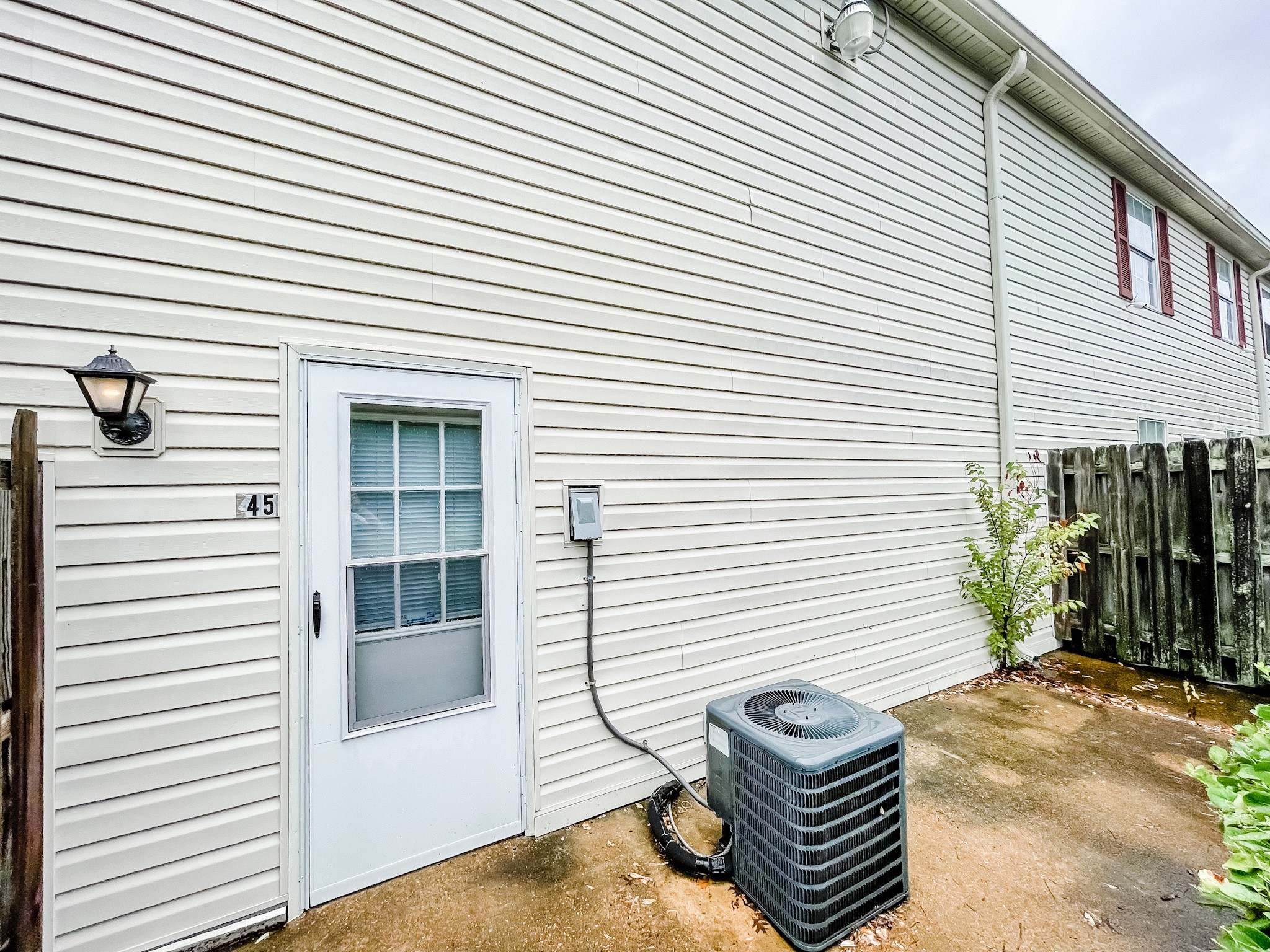 1301 Neelys Bend Road, Unit 45 Madison, TN 37115 - Photo 5 of 19 a view of a porch with furniture and floor to ceiling window