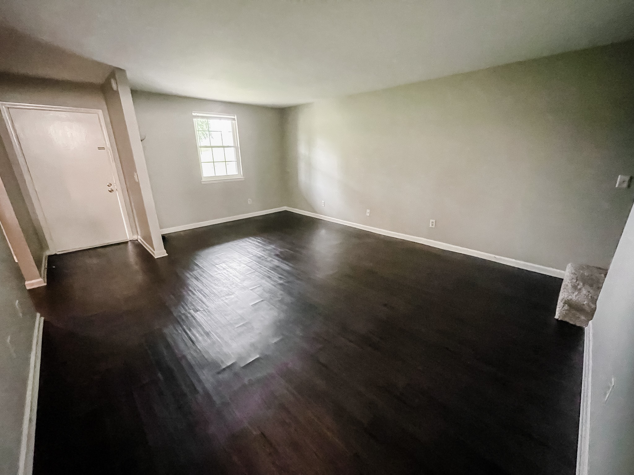 1301 Neelys Bend Road, Unit 45 Madison, TN 37115 - Photo 9 of 19 an empty room with wooden floor and windows