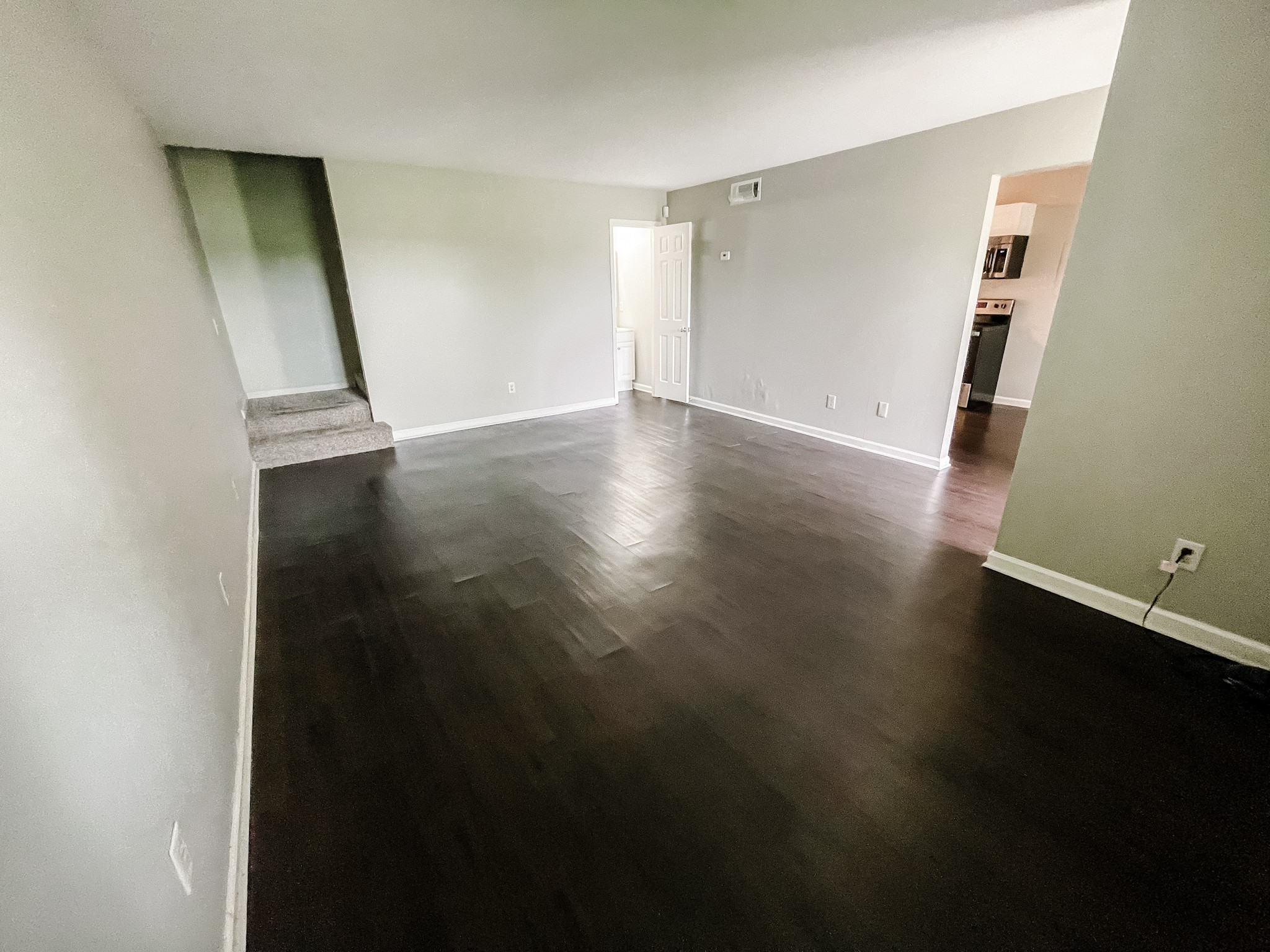 1301 Neelys Bend Road, Unit 45 Madison, TN 37115 - Photo 10 of 19 an empty room with wooden floor and entrance
