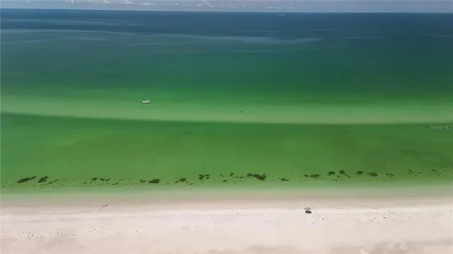 a view of lake with green space