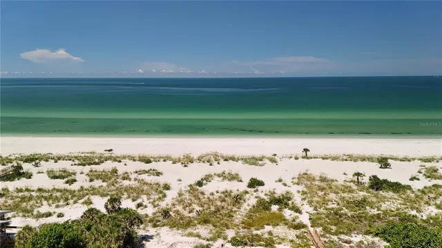 a view of a lake and a yard