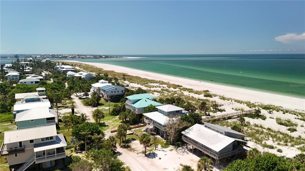 9502 Alborado Road Placida, FL 33946 - Photo 23 of 61 an aerial view of residential houses with outdoor space