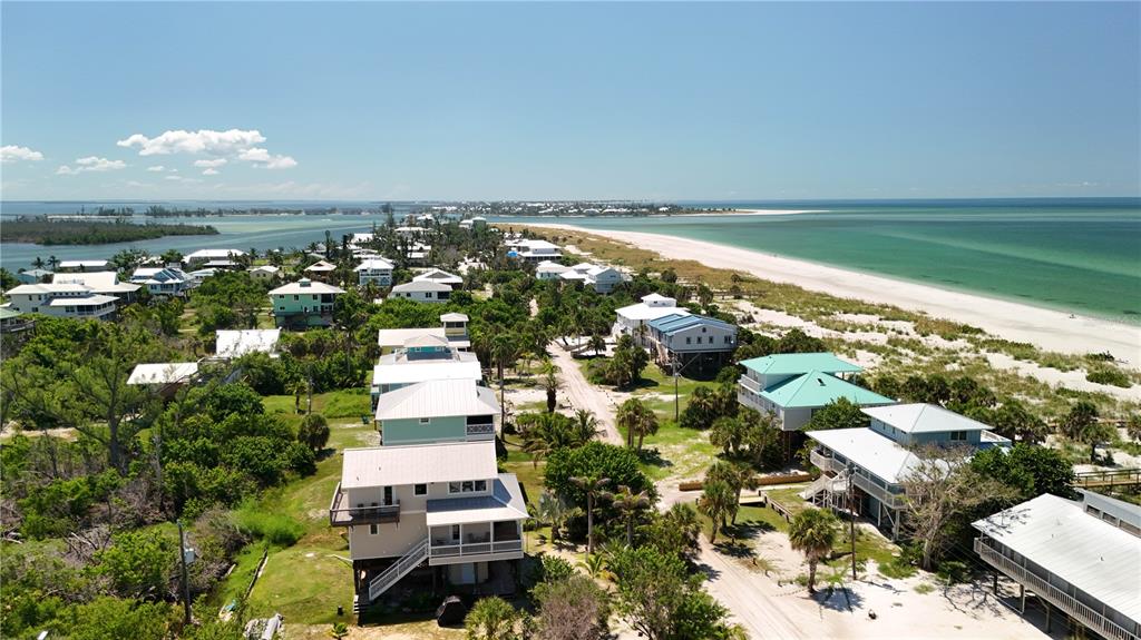 9502 Alborado Road Placida, FL 33946 - Photo 24 of 61 an aerial view of a house with a lake view