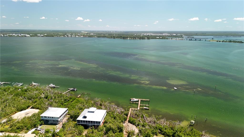 9502 Alborado Road Placida, FL 33946 - Photo 40 of 61 a view of a lake from a balcony