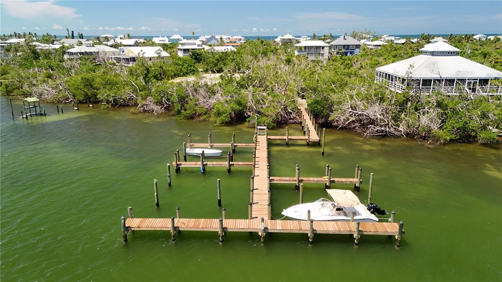 9502 Alborado Road Placida, FL 33946 - Photo 4 of 61 an aerial view of a house with a lake view