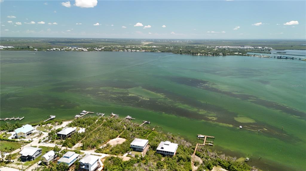 9502 Alborado Road Placida, FL 33946 - Photo 41 of 61 a view of a lake from a yard