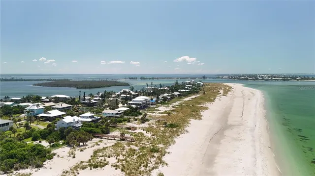 an aerial view of a house with a ocean view