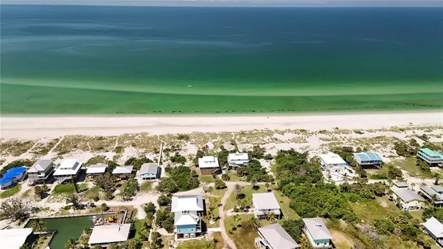 an aerial view of house with yard