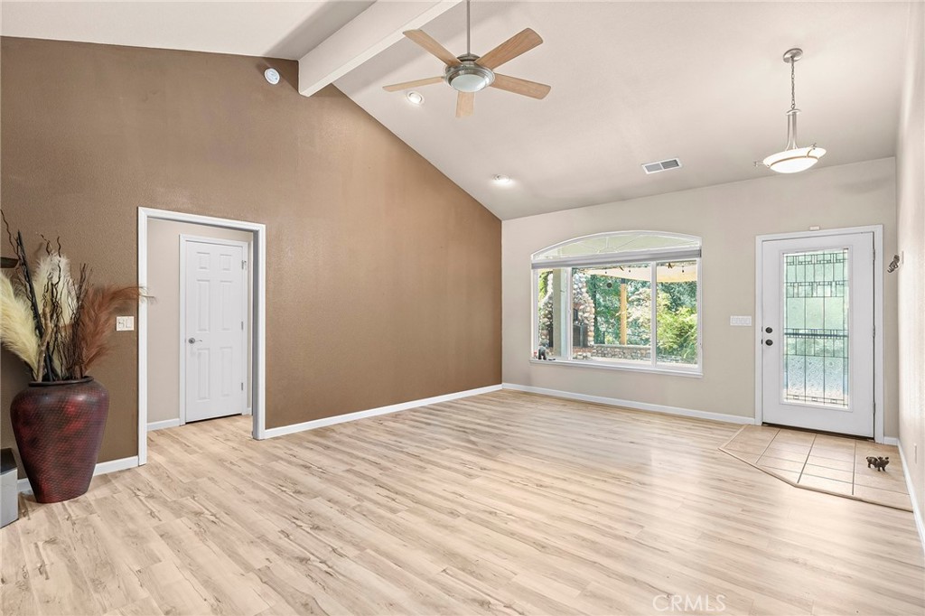 2262 Honey Run Road Chico, CA 95928 - Photo 12 of 74 a view of an empty room with a window and wooden floor