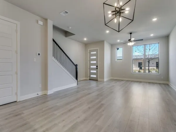 a view of an entryway with wooden floor