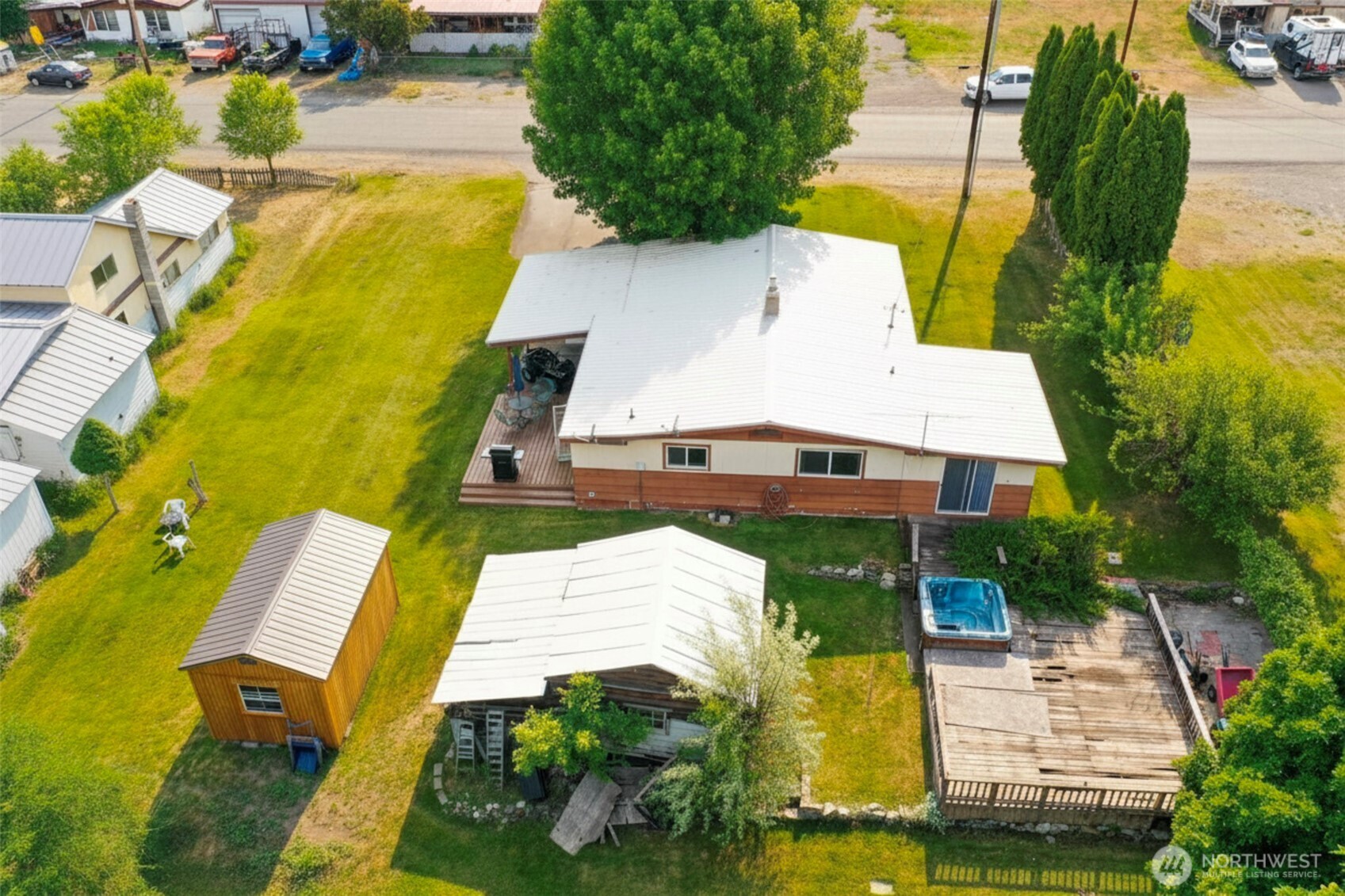 518 Bridge Street Twisp, WA 98856 - Photo 5 of 40 an aerial view of a house with swimming pool and large trees