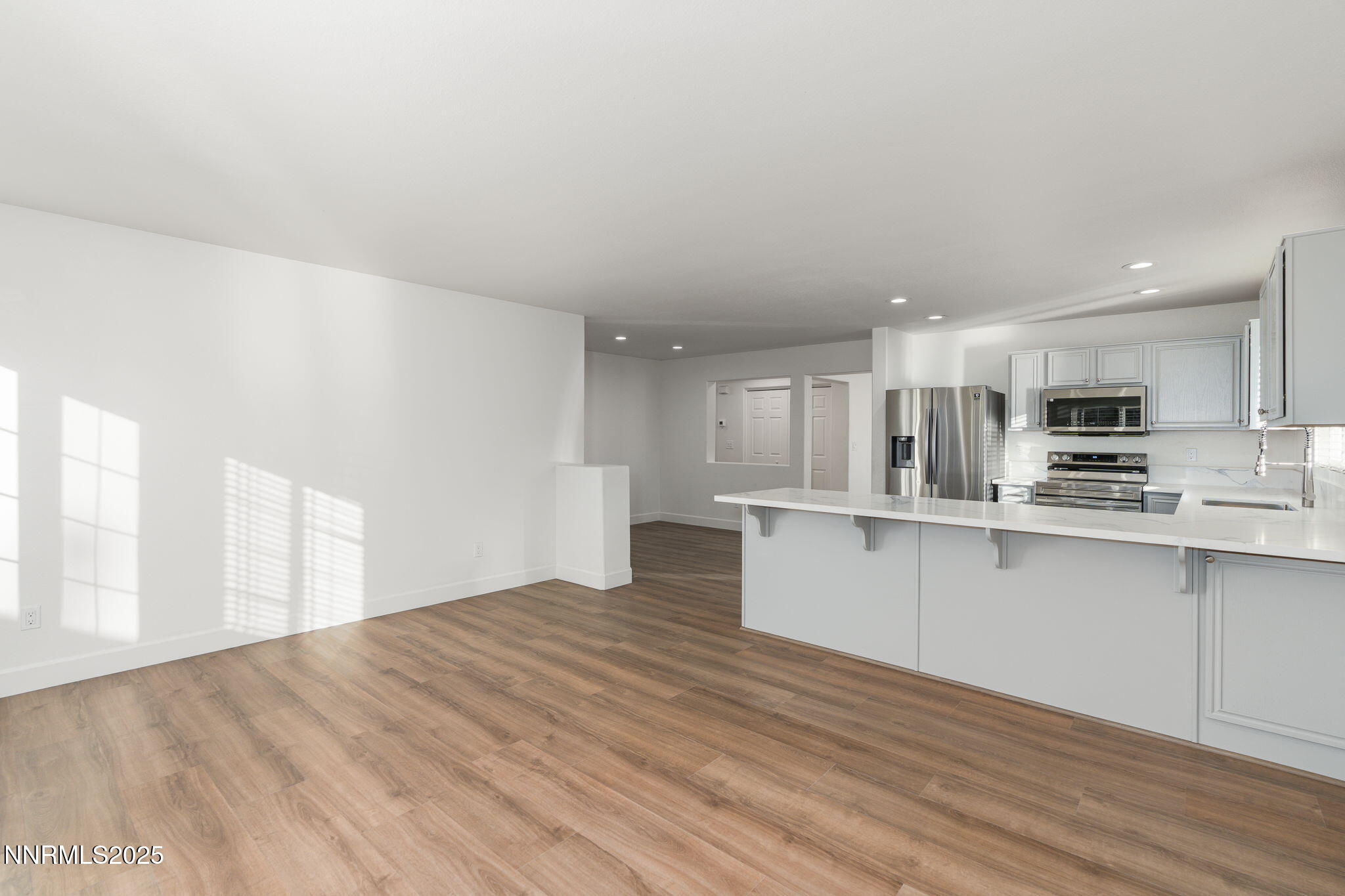 2905 Scepter Court Reno, NV 89503 - Photo 12 of 30 a view of kitchen with wooden floor and electronic appliances