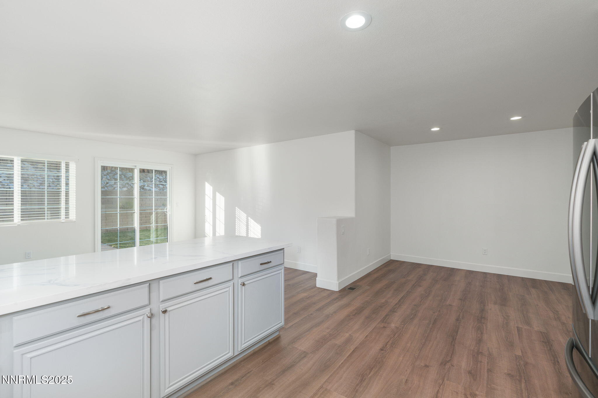 2905 Scepter Court Reno, NV 89503 - Photo 13 of 30 a hallway with wooden floors and cabinet
