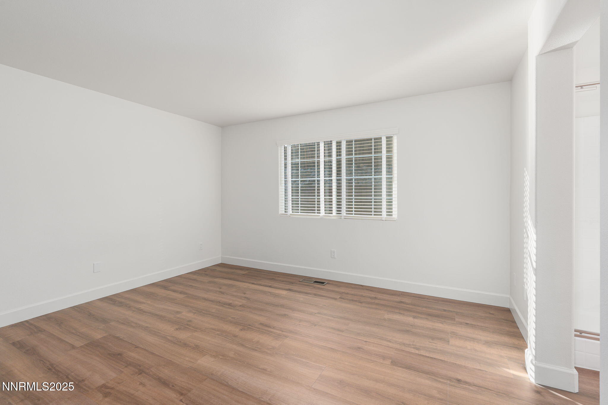 2905 Scepter Court Reno, NV 89503 - Photo 17 of 30 a view of empty room with wooden floor and fan