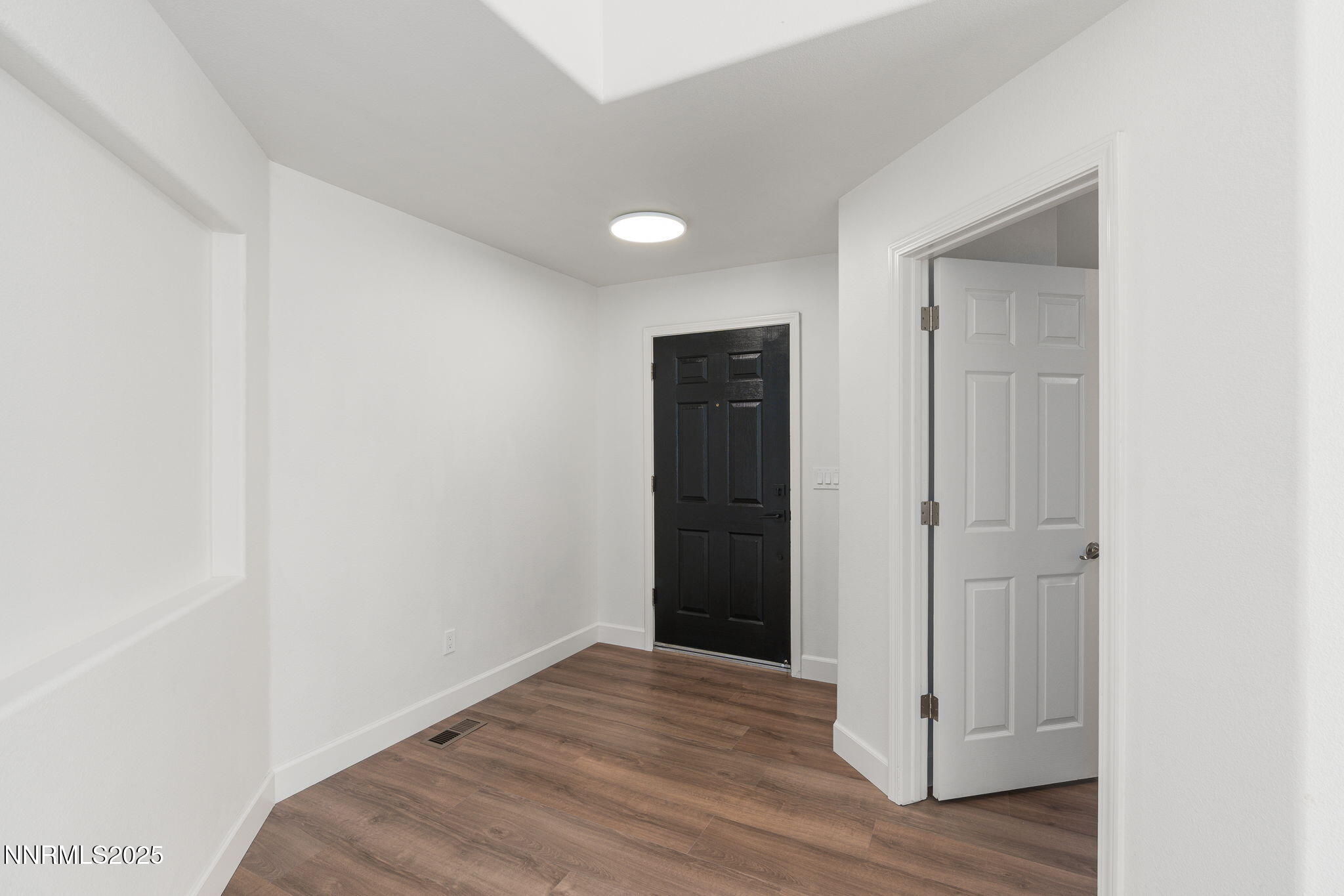 2905 Scepter Court Reno, NV 89503 - Photo 4 of 30 a view of an empty room with wooden floor