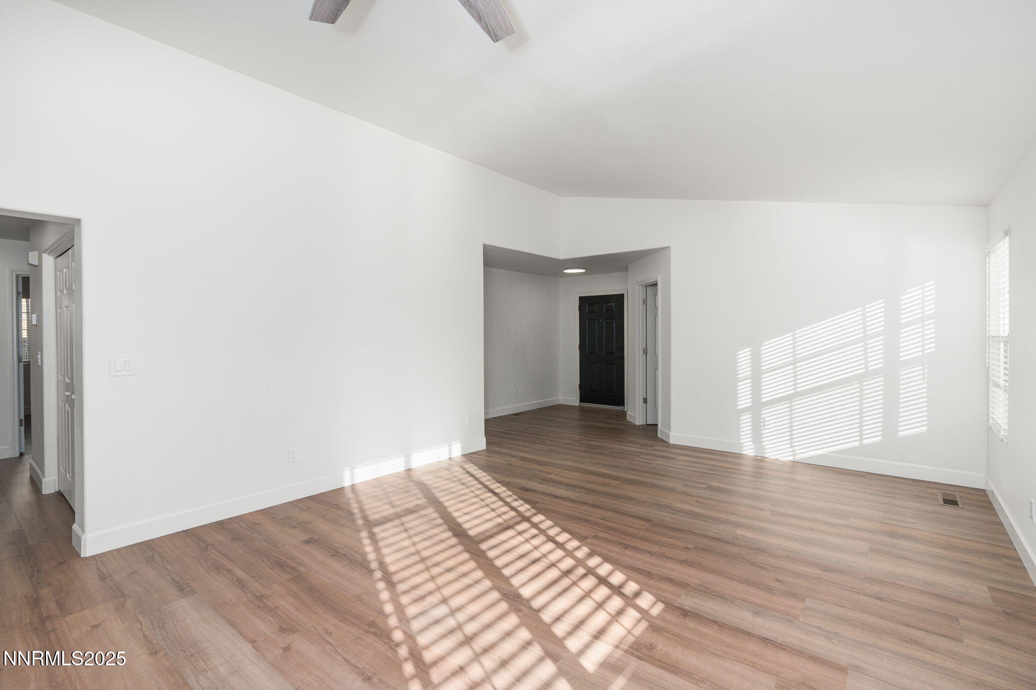 2905 Scepter Court Reno, NV 89503 - Photo 6 of 30 a view of an empty room with wooden floor and a window