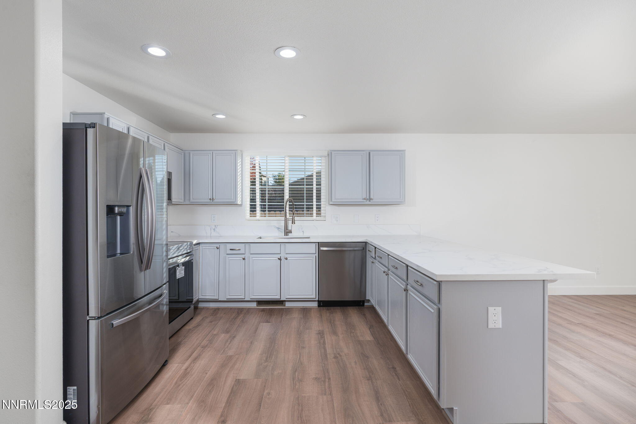 2905 Scepter Court Reno, NV 89503 - Photo 8 of 30 a kitchen with a sink refrigerator and cabinets