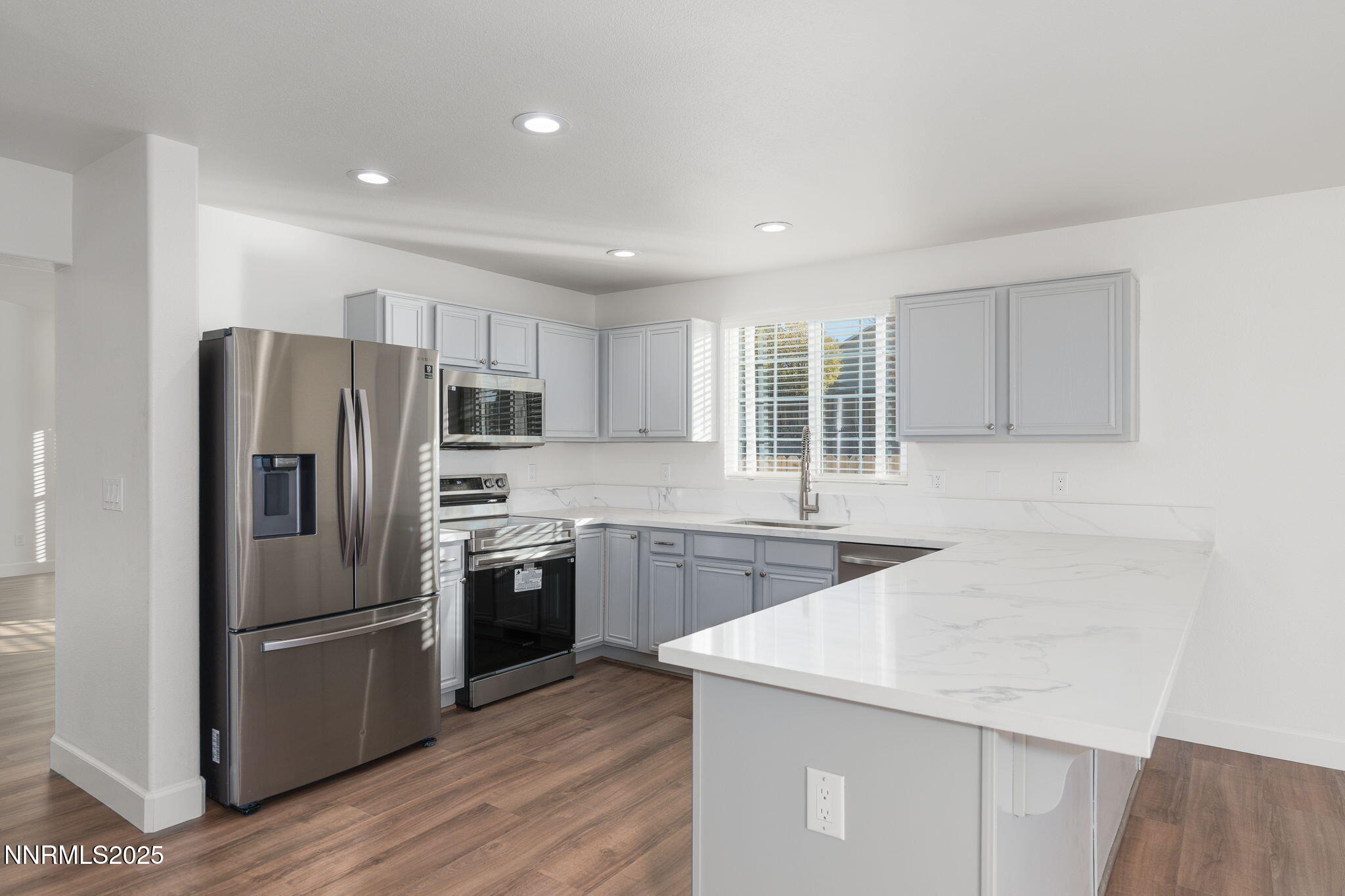 2905 Scepter Court Reno, NV 89503 - Photo 9 of 30 a kitchen with stainless steel appliances a refrigerator sink and microwave