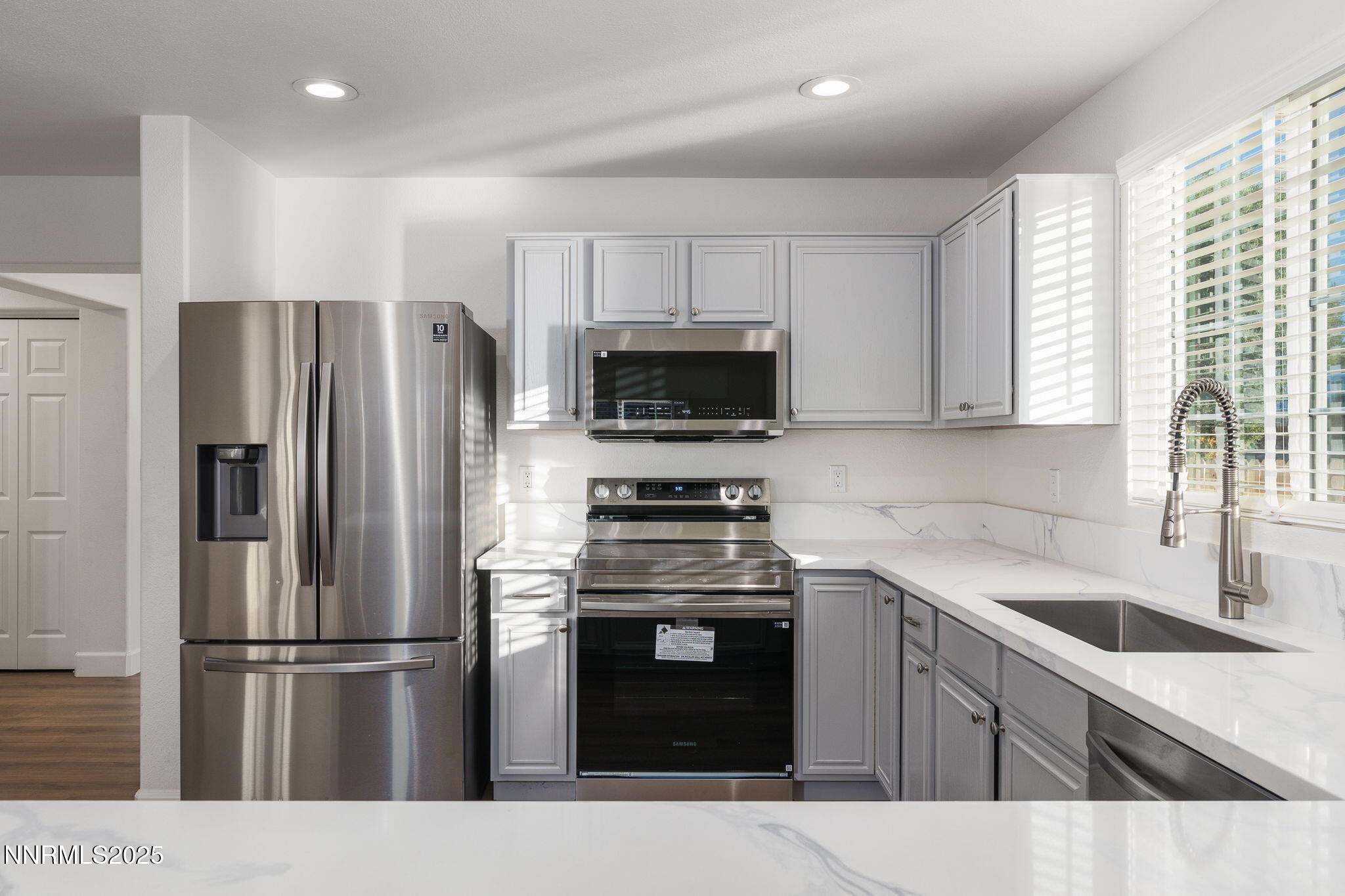 2905 Scepter Court Reno, NV 89503 - Photo 10 of 30 a kitchen with a sink stove and refrigerator