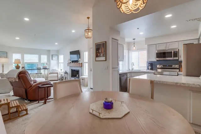 a living room with furniture kitchen and a kitchen island