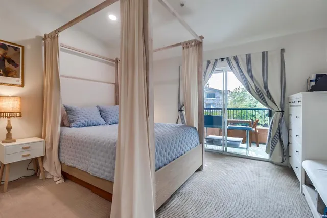 a balcony with table and chairs