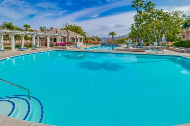 a view of a swimming pool with a patio