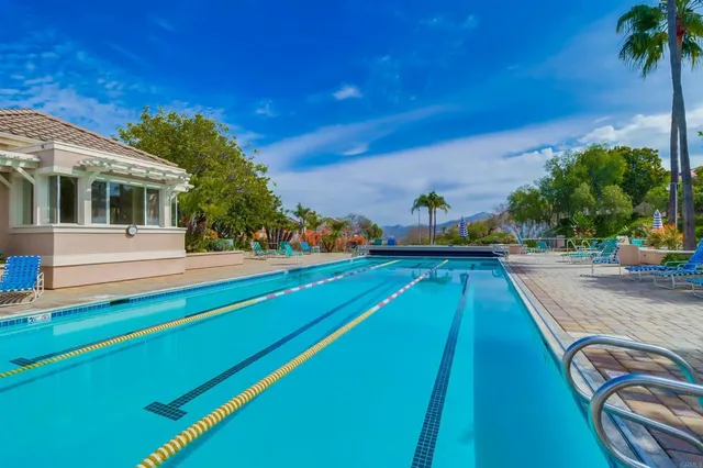 a view of a swimming pool with a patio