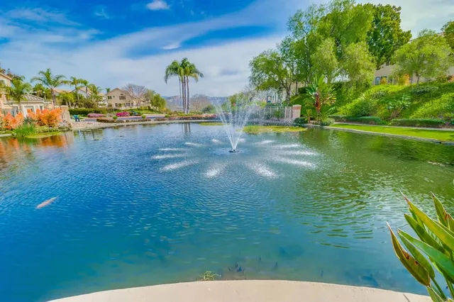 a view of swimming pool with outdoor seating and city view