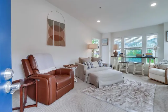 a living room with furniture and a gate