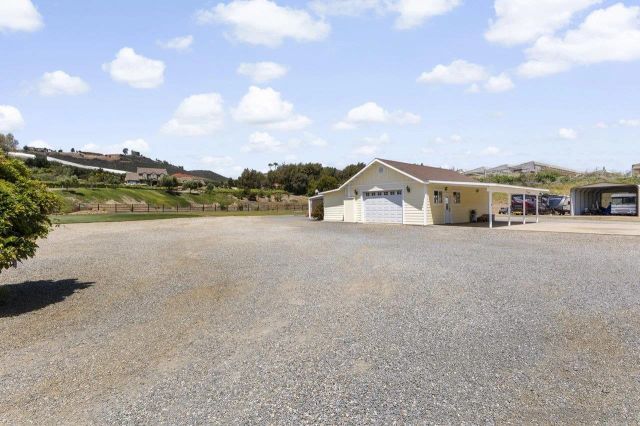 a view of a house with a big yard
