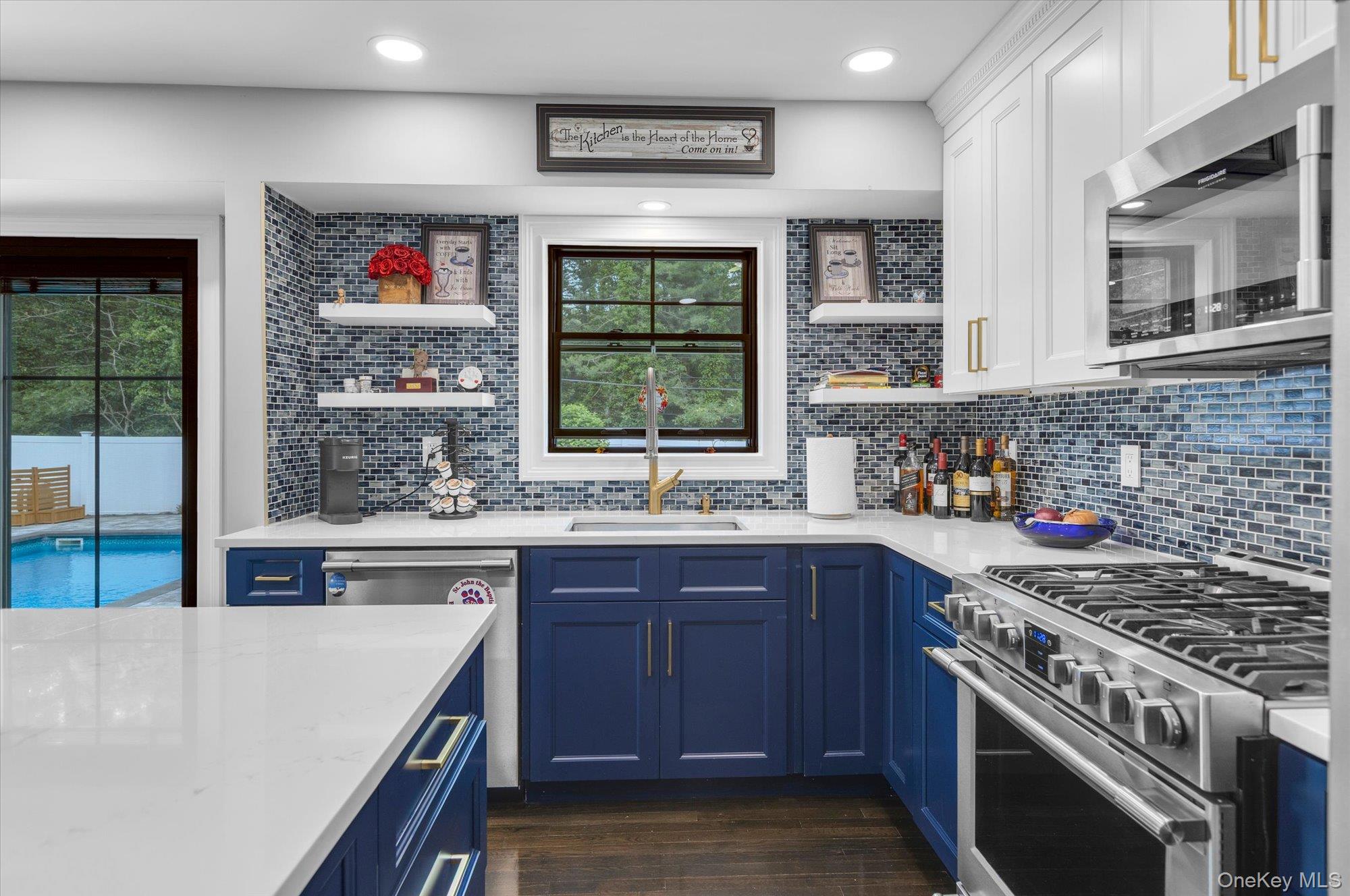 31 Apple Lane Commack, NY 11725 - Photo 6 of 28 Completely renovated with beautiful modern cabinetry. Stone countertops and counter to ceiling tile backsplash.