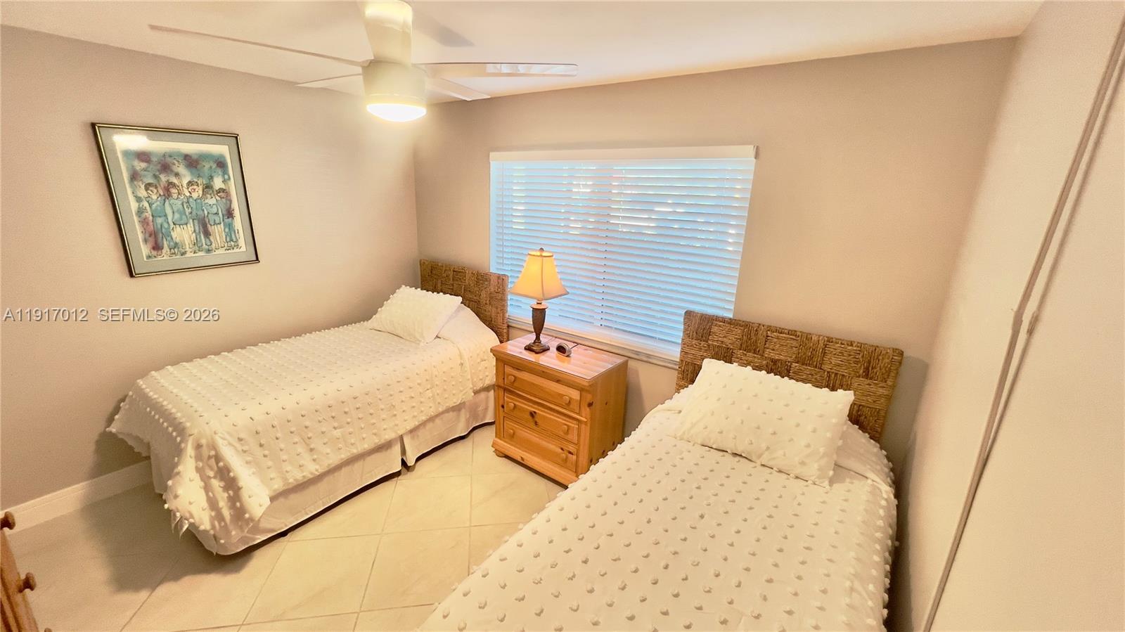 4380 27th Court Southwest, Unit 1104 Naples, FL 34116 - Photo 11 of 22 a bedroom with bed and a window