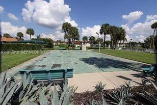 4380 27th Court Southwest, Unit 1104 Naples, FL 34116 - Photo 18 of 22 a view of a backyard