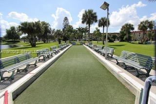 4380 27th Court Southwest, Unit 1104 Naples, FL 34116 - Photo 19 of 22 a view of a lake with a city