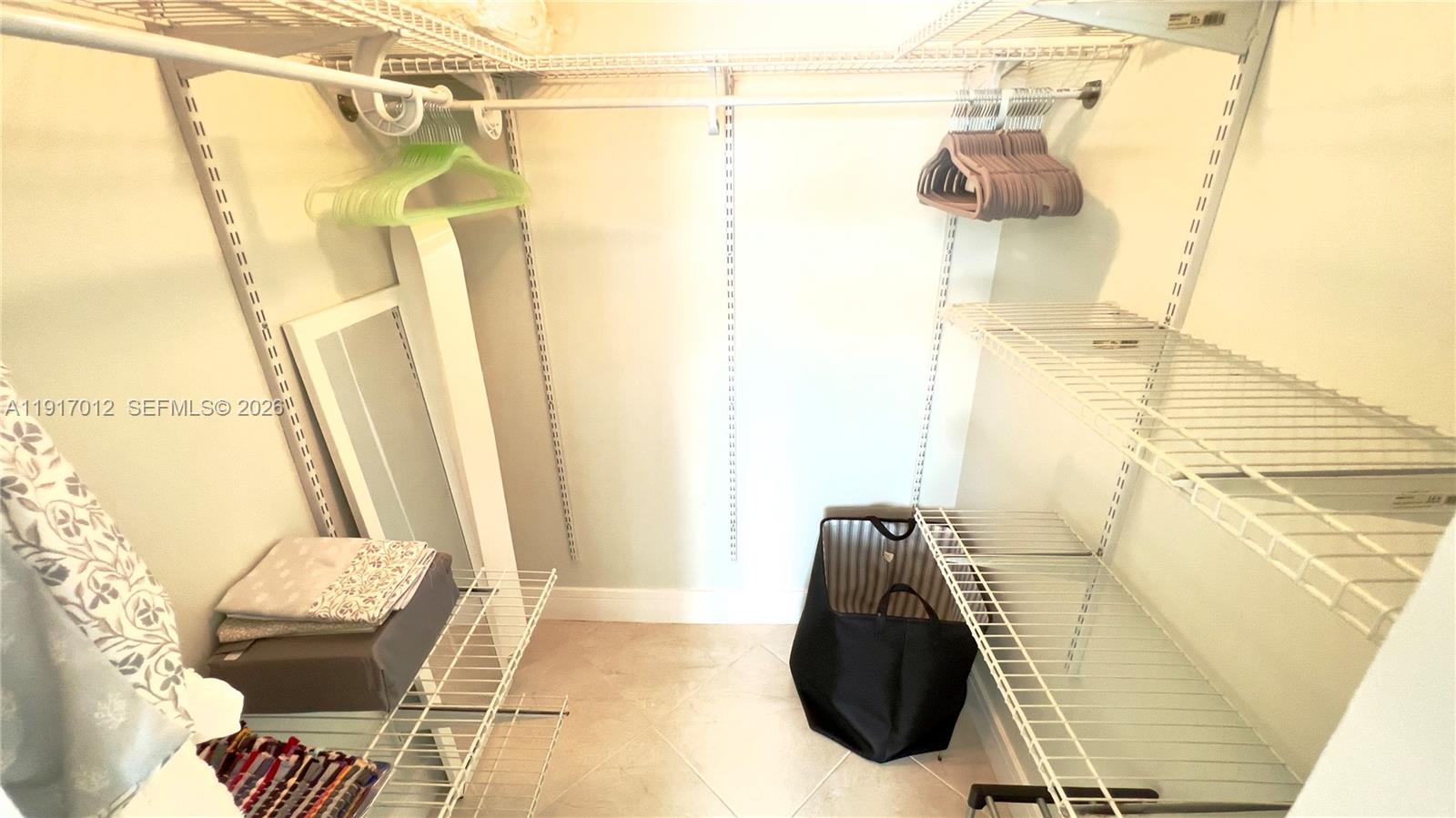 4380 27th Court Southwest, Unit 1104 Naples, FL 34116 - Photo 10 of 22 a bathroom with a sink and mirror
