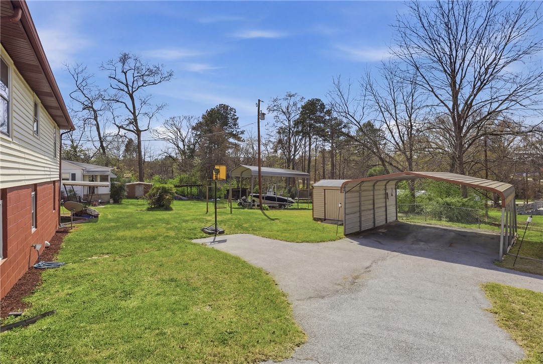 602 South Tugaloo Street Walhalla, SC 29691 - Photo 29 of 39 This spacious yard offers ample outdoor opportunities, including covered parking and a storage shed.