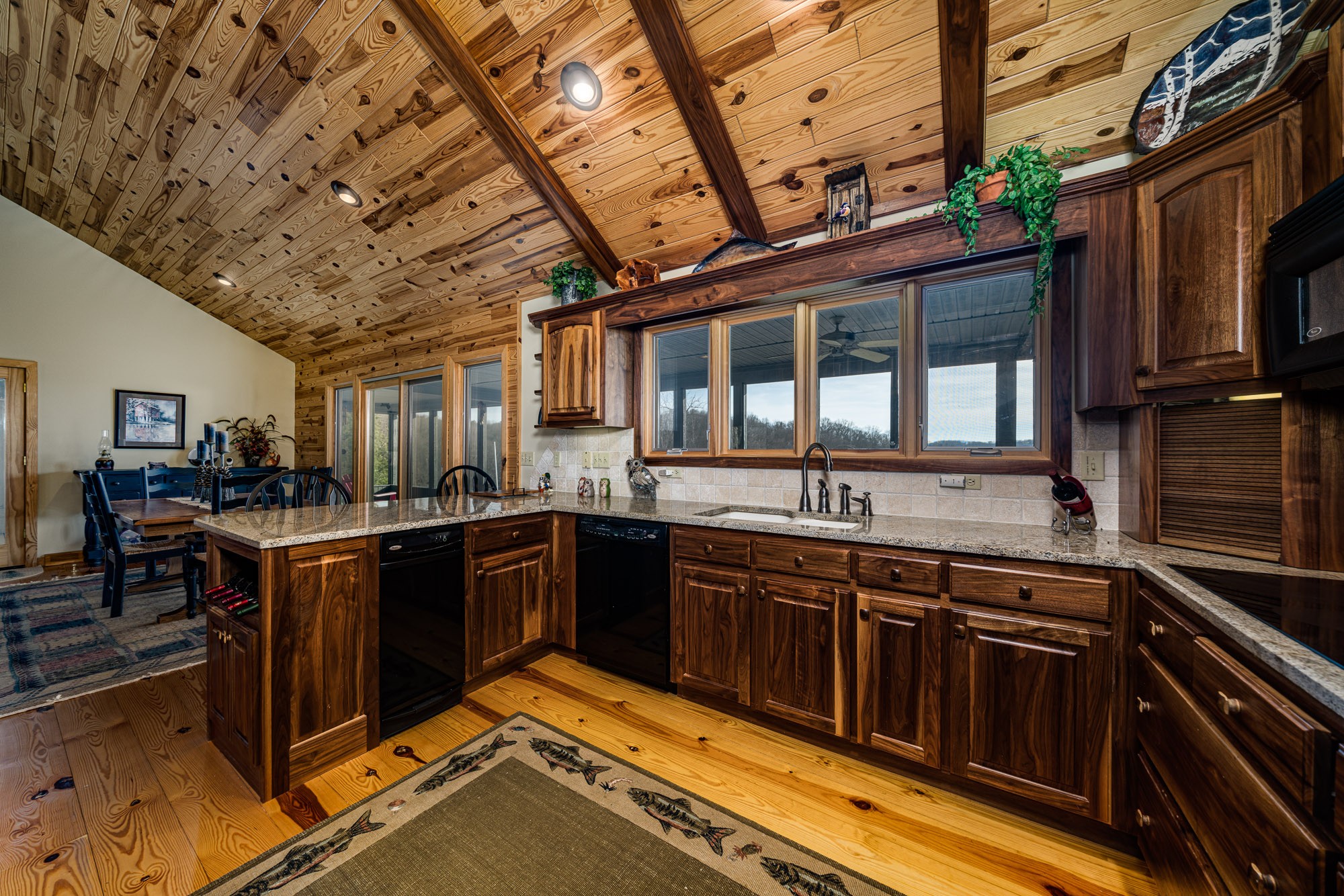 533 Mallard Pointe Road Byrdstown, TN 38549 - Photo 14 of 34 a kitchen with stainless steel appliances granite countertop a stove and a sink