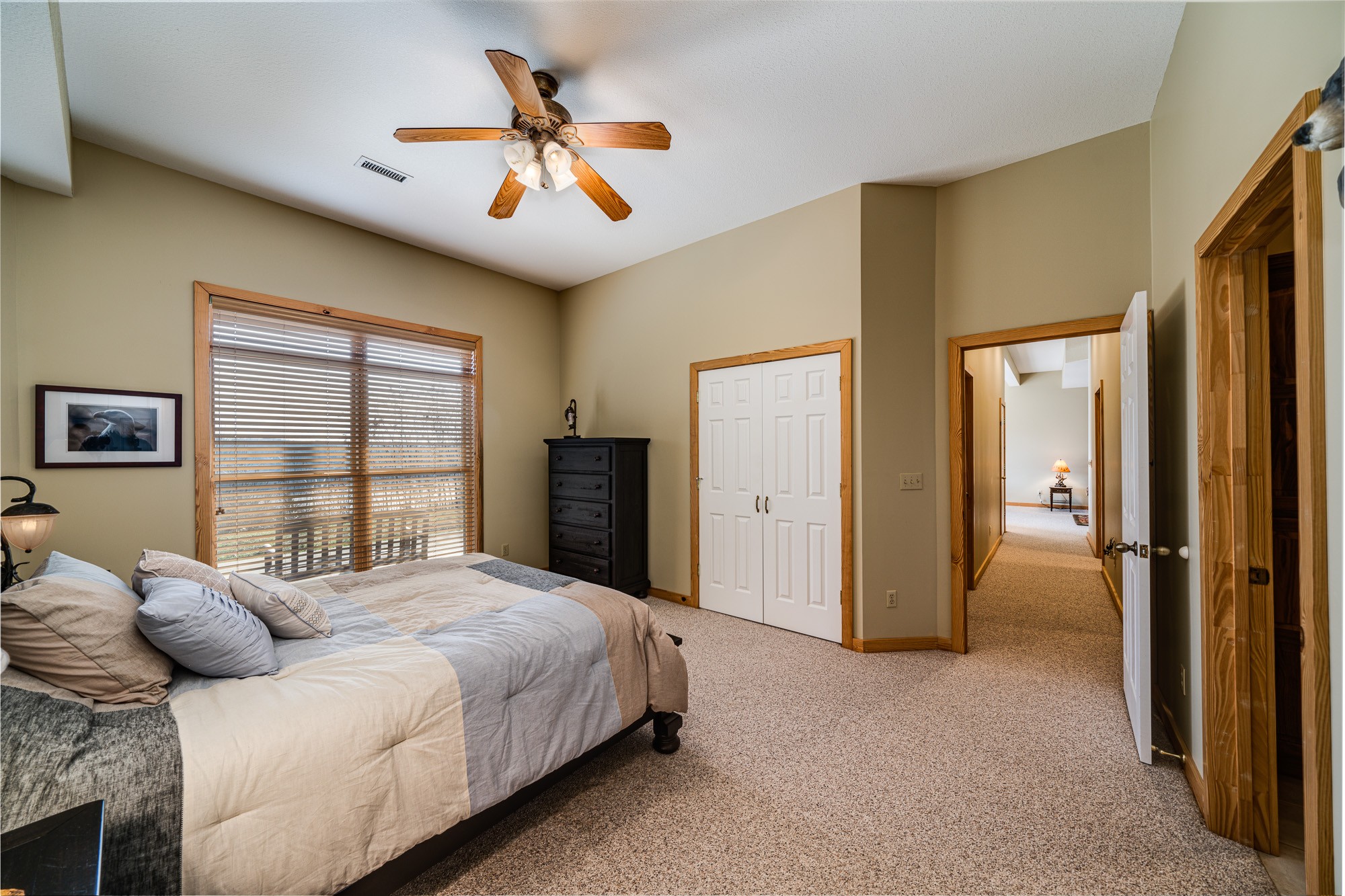 533 Mallard Pointe Road Byrdstown, TN 38549 - Photo 22 of 34 a bedroom with a bed and a chandelier