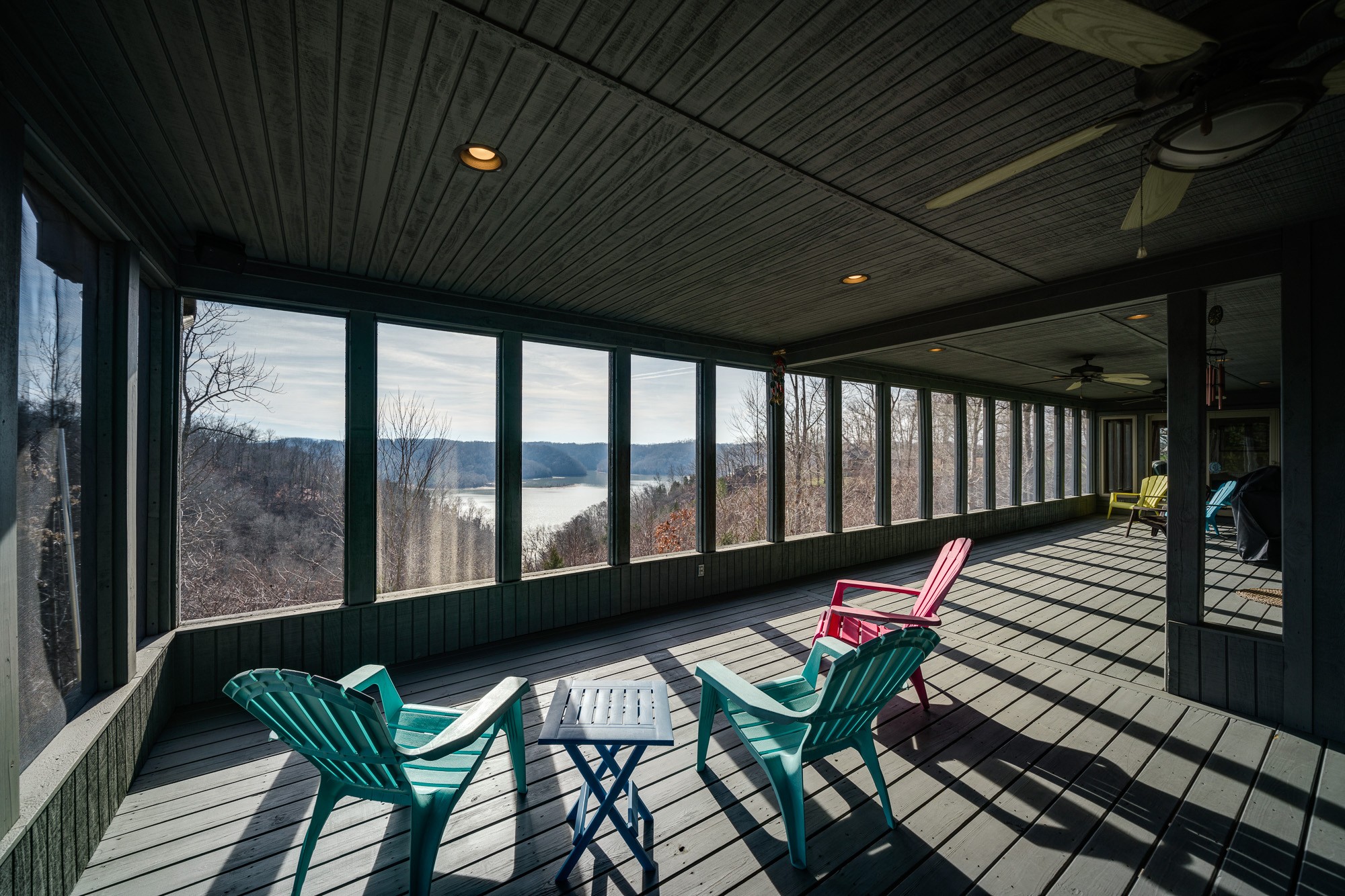 533 Mallard Pointe Road Byrdstown, TN 38549 - Photo 31 of 34 a balcony with wooden floor stairs and a table