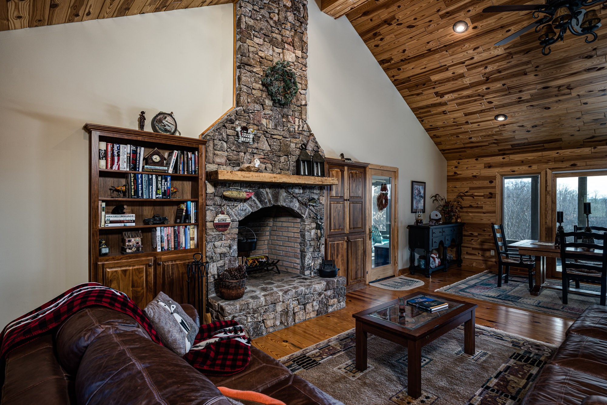 533 Mallard Pointe Road Byrdstown, TN 38549 - Photo 7 of 34 a living room with furniture a rug and a fireplace