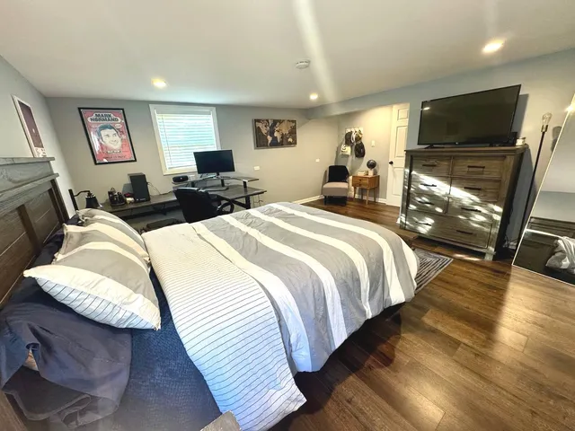 a bed room with two bed and a flat screen tv