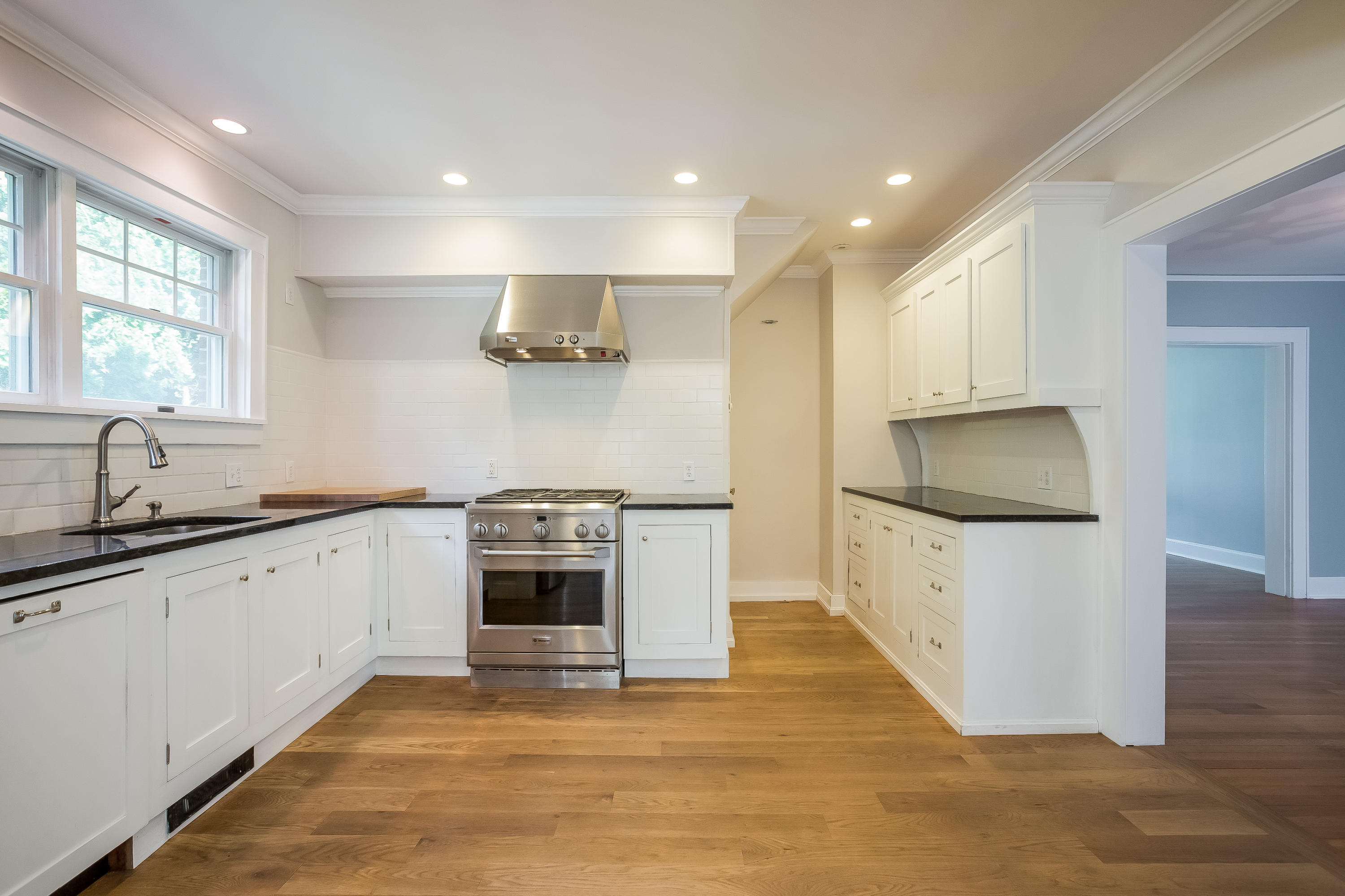 8 Garden City Road Darien, CT 06820 - Photo 9 of 30 a kitchen with granite countertop a stove and a sink