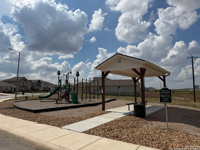 a view of a park with swings