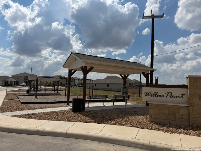 a front view of a building with sign board