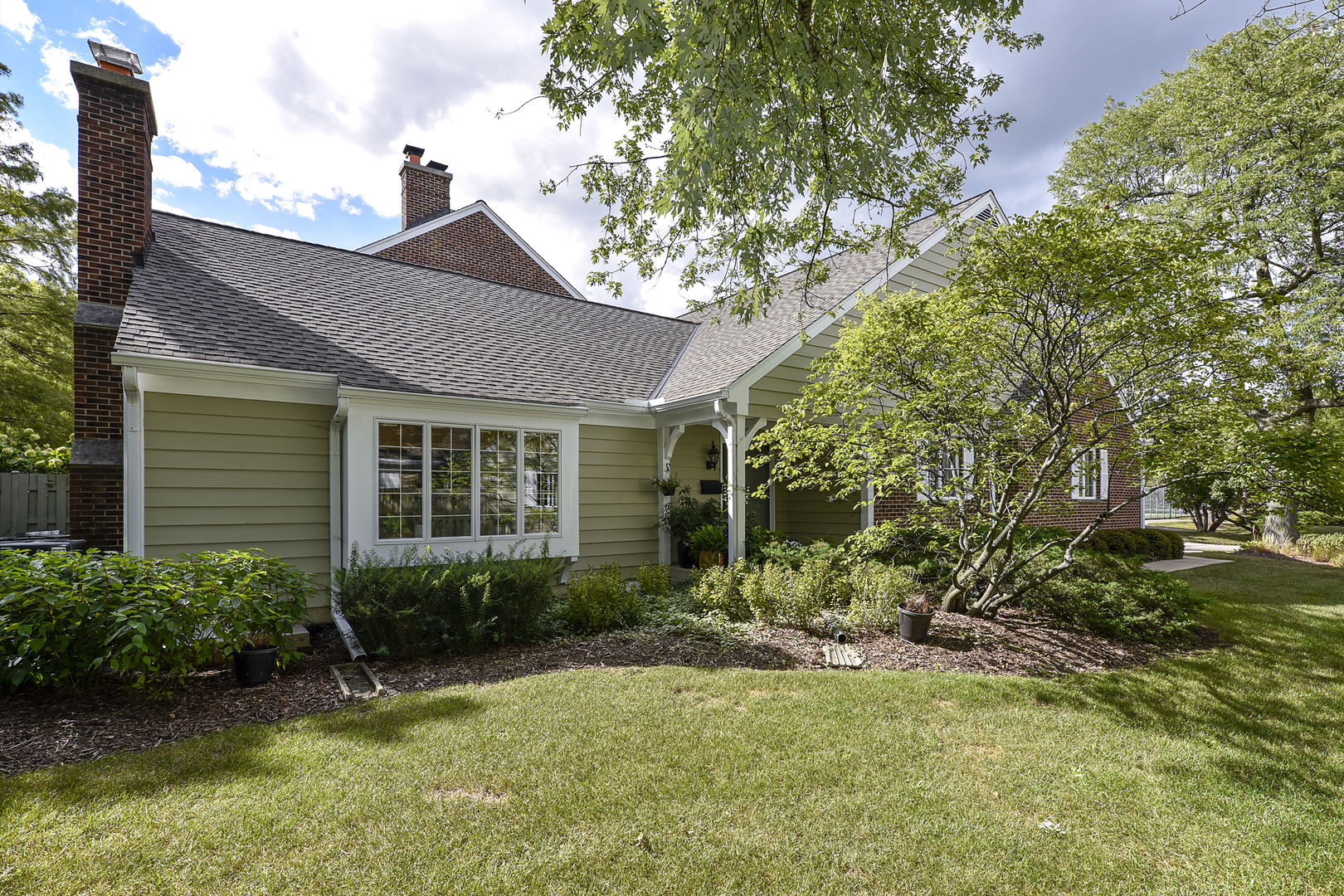 1479 West Shire Circle Inverness, IL 60067 - Photo 2 of 19 a view of a house with a yard and plants