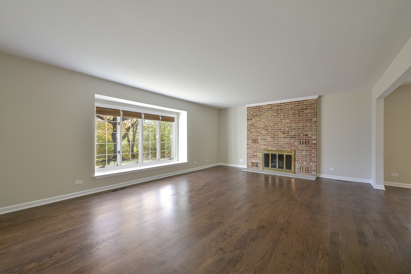 1479 West Shire Circle Inverness, IL 60067 - Photo 3 of 19 a view of an empty room with wooden floor and a window