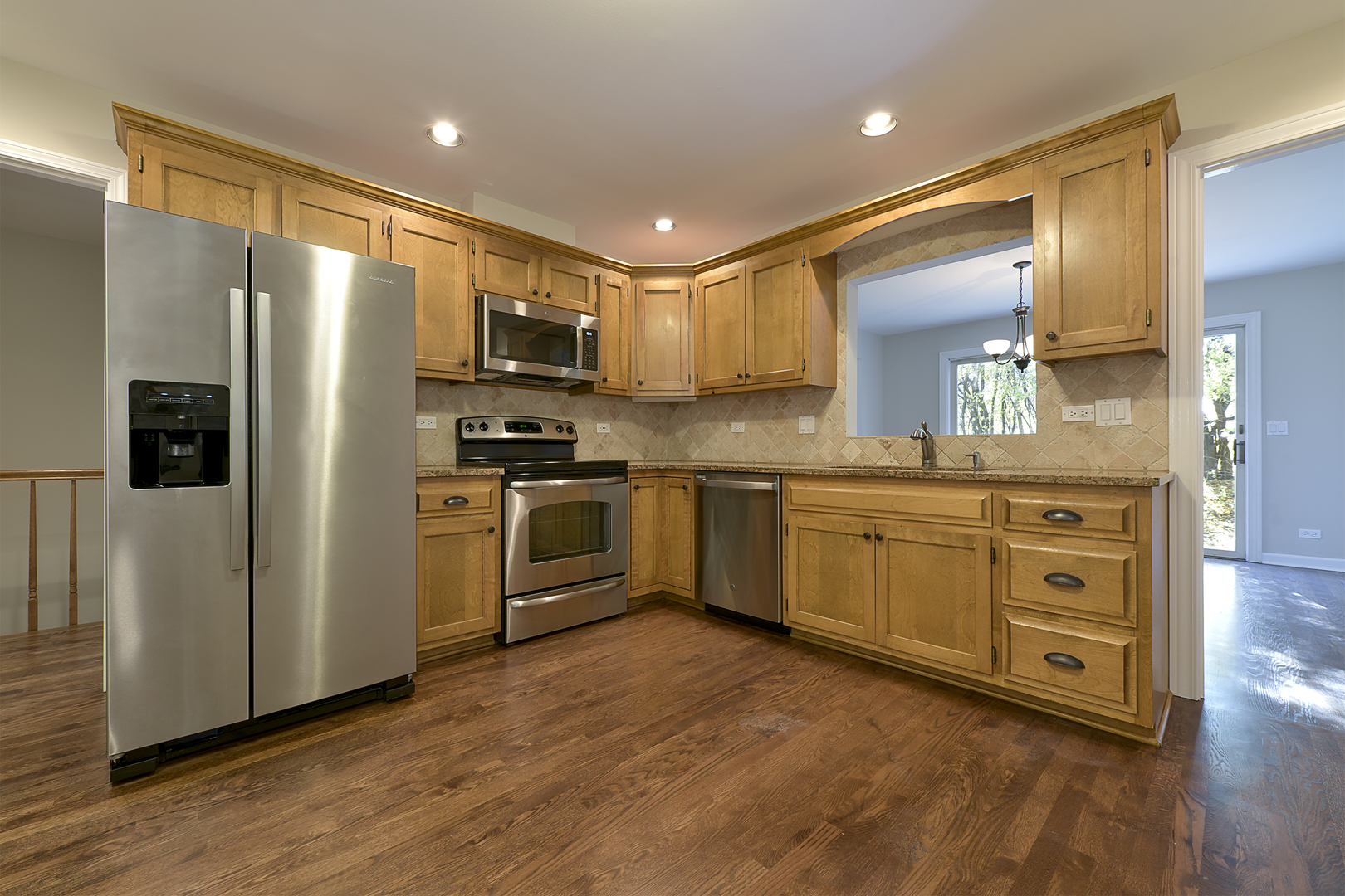 1479 West Shire Circle Inverness, IL 60067 - Photo 5 of 19 a kitchen with stainless steel appliances a refrigerator sink and microwave