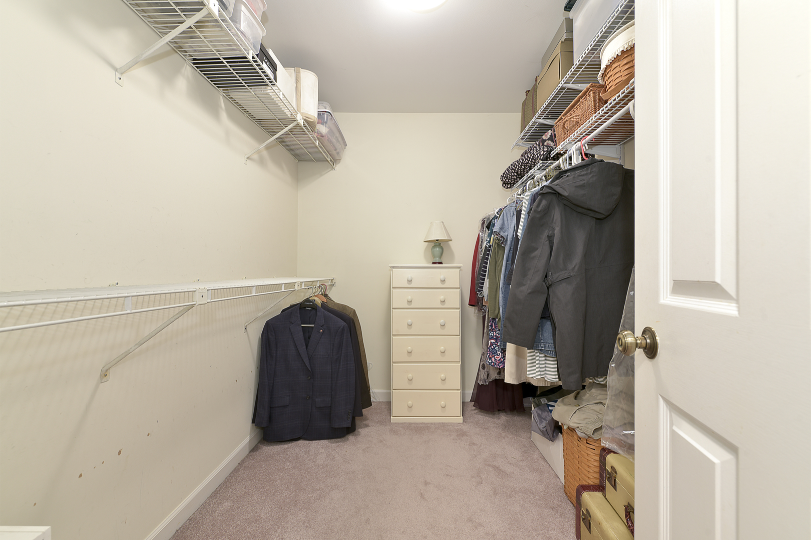 1479 West Shire Circle Inverness, IL 60067 - Photo 10 of 19 a view of walk in closet with clothes and shoes